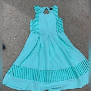 Girls blue sleeveless dress with lace and cutout back